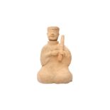 A CHINESE POTTERY FIGURE OF A MUSICIAN 漢 陶樂人坐像