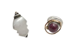 A GEM-SET RING AND A MONEY CLIP BY TOM McEWAN