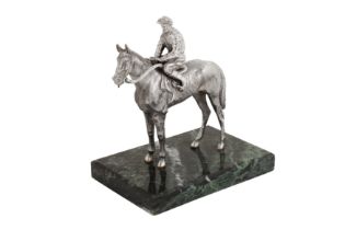 An Elizabeth II sterling silver model of a jockey on horseback, London 1985 by B S E Products