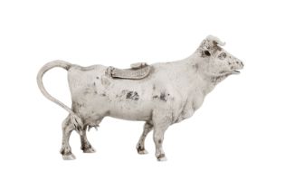 A late 19th century Dutch sterling silver cow creamer, import marks London 1889 by Edwin Thomas Brya