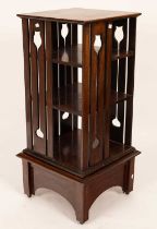 An Arts & Crafts style oak revolving bookcase