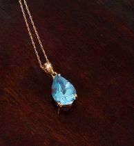 A pear-shaped blue topaz pendant