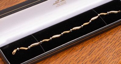 An 18ct gold and diamond bracelet