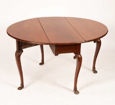 A George III mahogany oval two-flap table