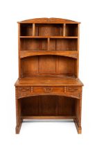 An Arts & Crafts style oak bookcase and desk