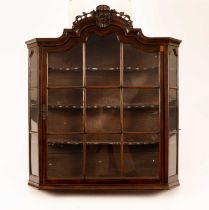 An 18th Century and later Dutch walnut glazed hanging cabinet