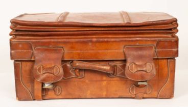 A leather travelling case by Ismail Usuf