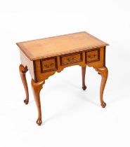 A 20th Century oak and walnut side table