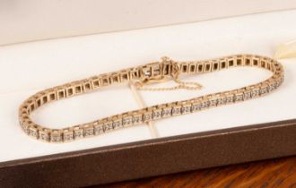 A 9ct gold and diamond tennis bracelet