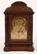 A late 19th Century carved walnut eight-day bracket clock