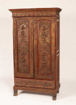 A Thai cupboard with red lacquer decoration