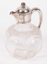 A Victorian silver mounted claret jug