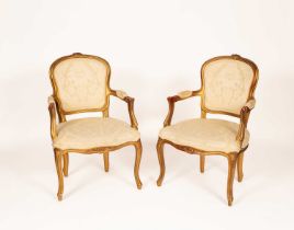 A pair of Louis XV style armchairs