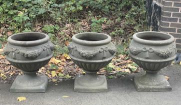 Three circular moulded garden vases