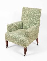 A mid 20th century upholstered armchair