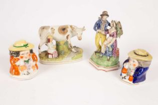 A Staffordshire figure of a cow and milkmaid