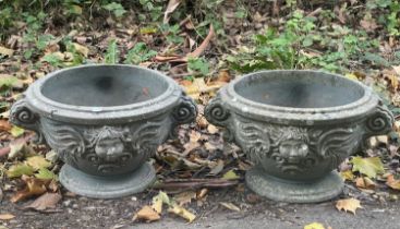 A pair of circular garden vases
