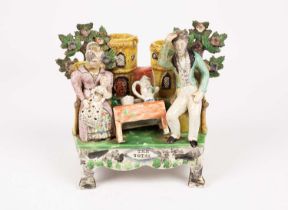 A Staffordshire pearlware table base figure group