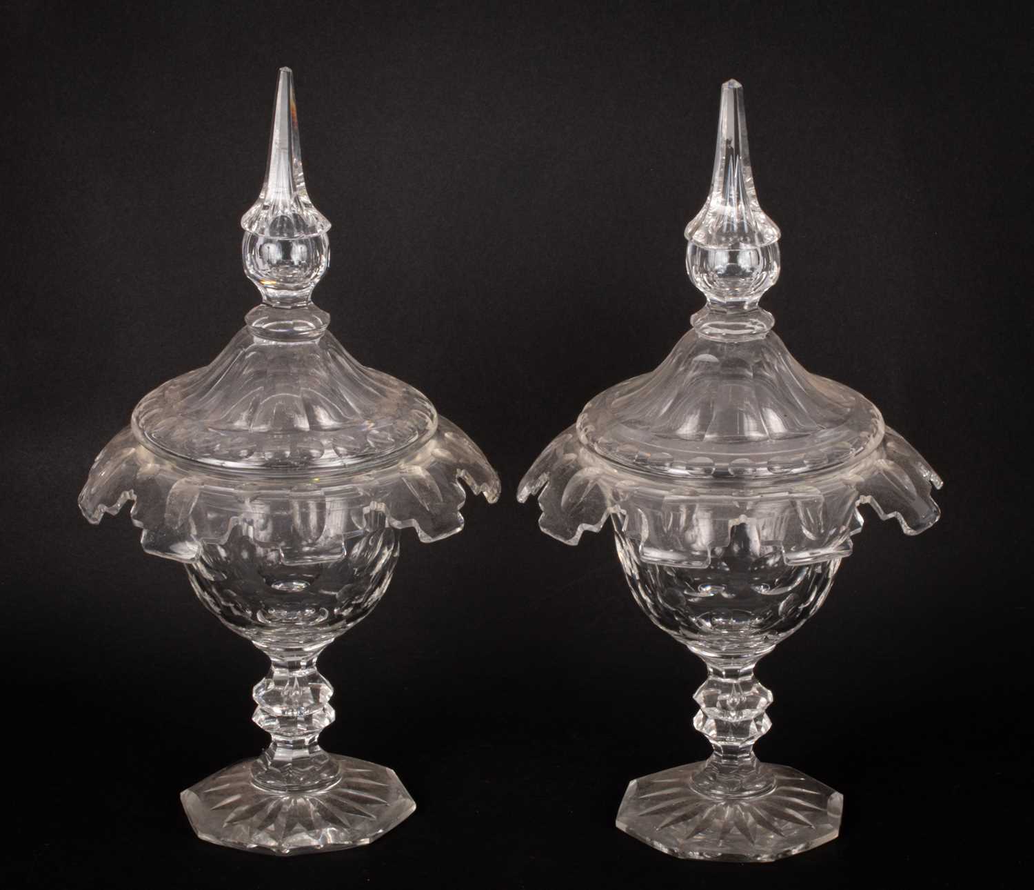 A pair of cut glass bonbon dishes and covers