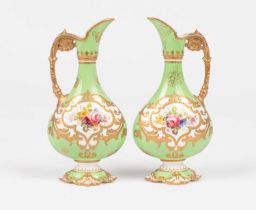 A pair of Royal Crown Derby small ewers