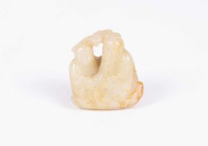 A Chinese jade carving of an old man and a boy