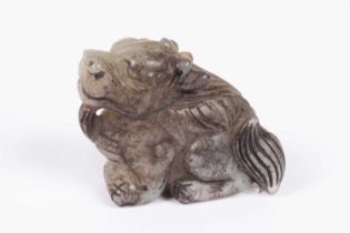 A Chinese jade carving of a grotesque beast