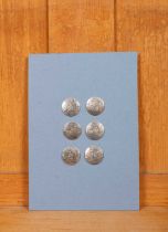 A set of six silver buttons