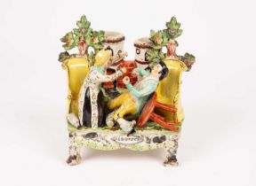 A Staffordshire pearlware table base figure group