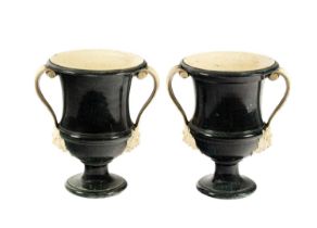 A pair of creamware 'porphyry' two-handled campana shaped urns