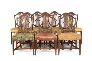 A composite set of ten George III mahogany shield back dining chairs