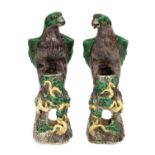 A pair of Chinese stoneware figures of hawks