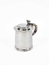 A Queen Anne plain cylindrical silver tankard