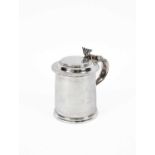 A Queen Anne plain cylindrical silver tankard