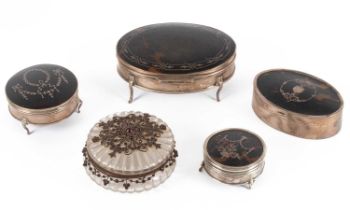 A group of silver and tortoiseshell mounted dressing table boxes