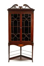 A George III Irish inlaid mahogany corner cabinet