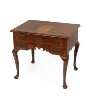 A George I style cross and featherbanded walnut lowboy