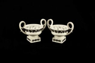 A pair of Wedgwood white stoneware potpourri vases