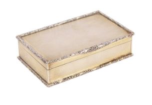 An Edwardian silver gilt cigarette box