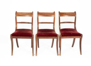 Three Regency mahogany dining chairs