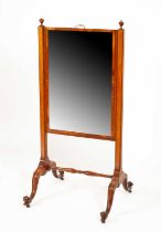 An Edwardian satin birch cheval mirror