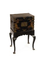 A Chinese small black and gilt lacquer cabinet on stand