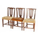 Three George III country made stained elm dining chairs