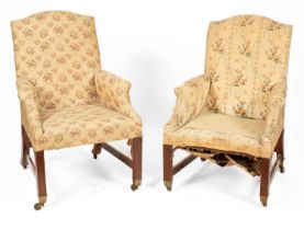 A near pair of Victorian easy armchairs