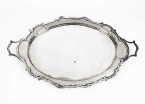 A large two-handled silver tray