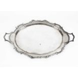 A large two-handled silver tray