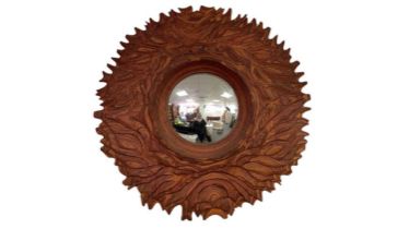 A laminated wood and stained convex mirror
