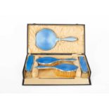 A silver and blue enamel dressing set
