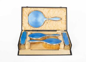 A silver and blue enamel dressing set