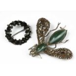 A white metal steel and agate bug brooch