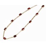 A garnet and 9ct gold necklace